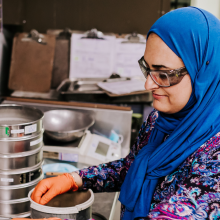 Woman wearing a blue veil working in a laboratory