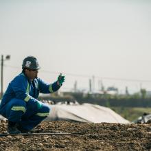 Worker in soil treatment center