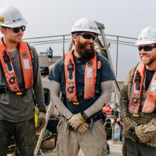 3 technicians on a boat