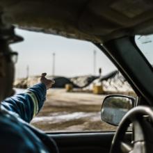 Worker driving a pick-up truck