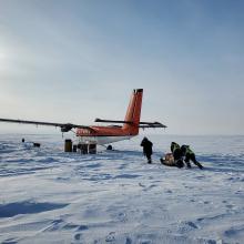 plane in high artic with crew