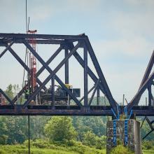 Drilling machine on a railway bridge