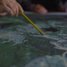 employee looking at a map