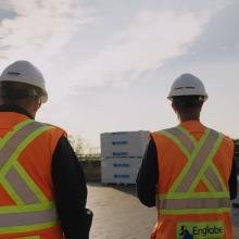 two workers on a roof