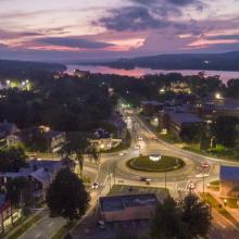 Aerial photo of the Victoria Circle roundabout at night, pink and purple sky