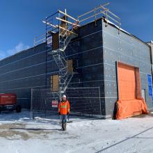 Kasandra Gauthier, Materials technician, standing outside of a building in the winter