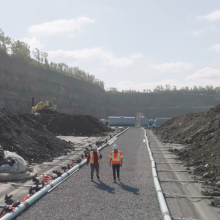 Two people walking down Demix quarry