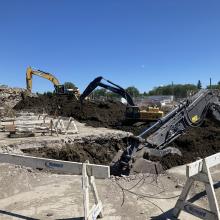 Machines digging at construction sites