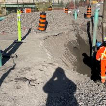 A photo from an instrumentation and monitoring job site from Olivia standing in the shadow