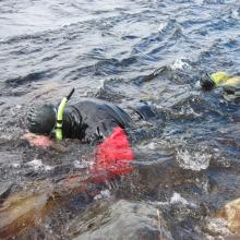 Englobe technician Steve Chevarie scuba diving on a project site