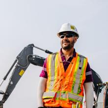 geotechnical engineer with safety protection working on a construction site.