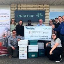 Photo of Englobe's team and Matawa Education group presenting the check of 4700$