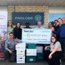 Photo of Englobe's team and Matawa Education group presenting the check of 4700$