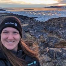 portrait of Lydia Charbonneau with beautiful sunset in background in Nunavut