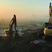 Machinery on environmental remediation project at sunset at former Petromont petrochemical plant