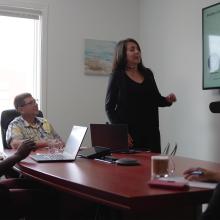 photo of Natacha Sénéchal presenting to colleagues in a boardroom