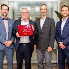 photo of François Santerre, André Thivierge, Alain Sanfaçon and Peter Allaby, holding their Canadian Consulting Engineer (CCE) Award trophy