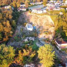 aerial view of a house swept away by a landslide in La Baie