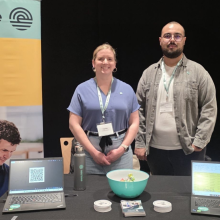 picture of a career event at ETS with two Englobe's ambassadors behing desk